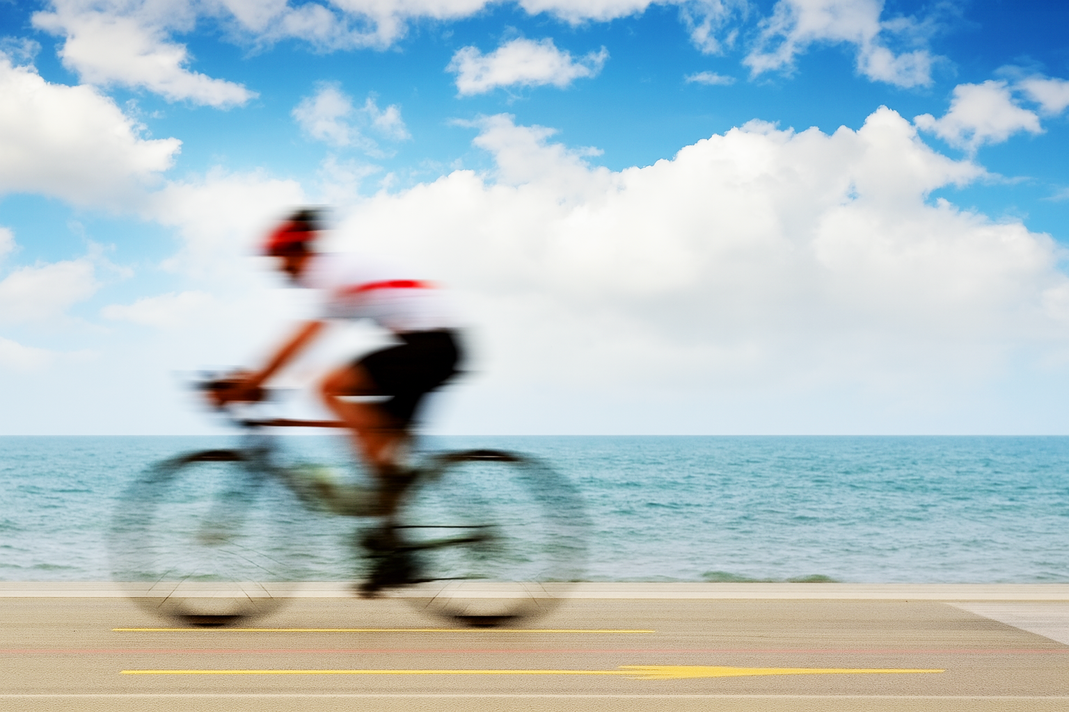 Cyclist riding along the lakefront